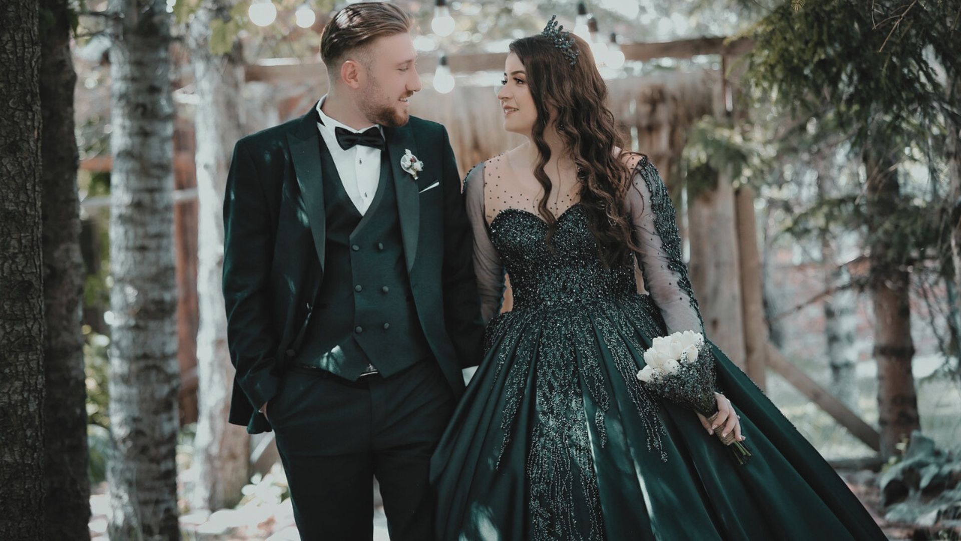 Bride and groom exchanging rings during their engagement ceremony.